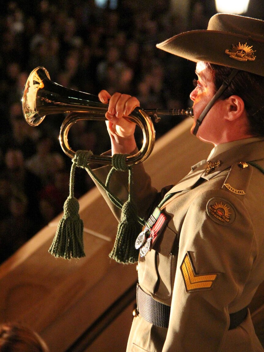 A bugler sounds the last post.