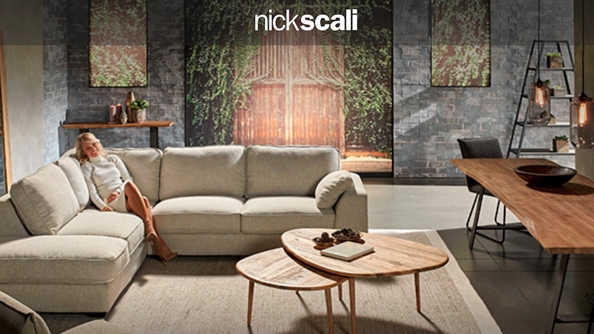 A screenshot of Nick Scali home page showing a woman sitting on a white couch