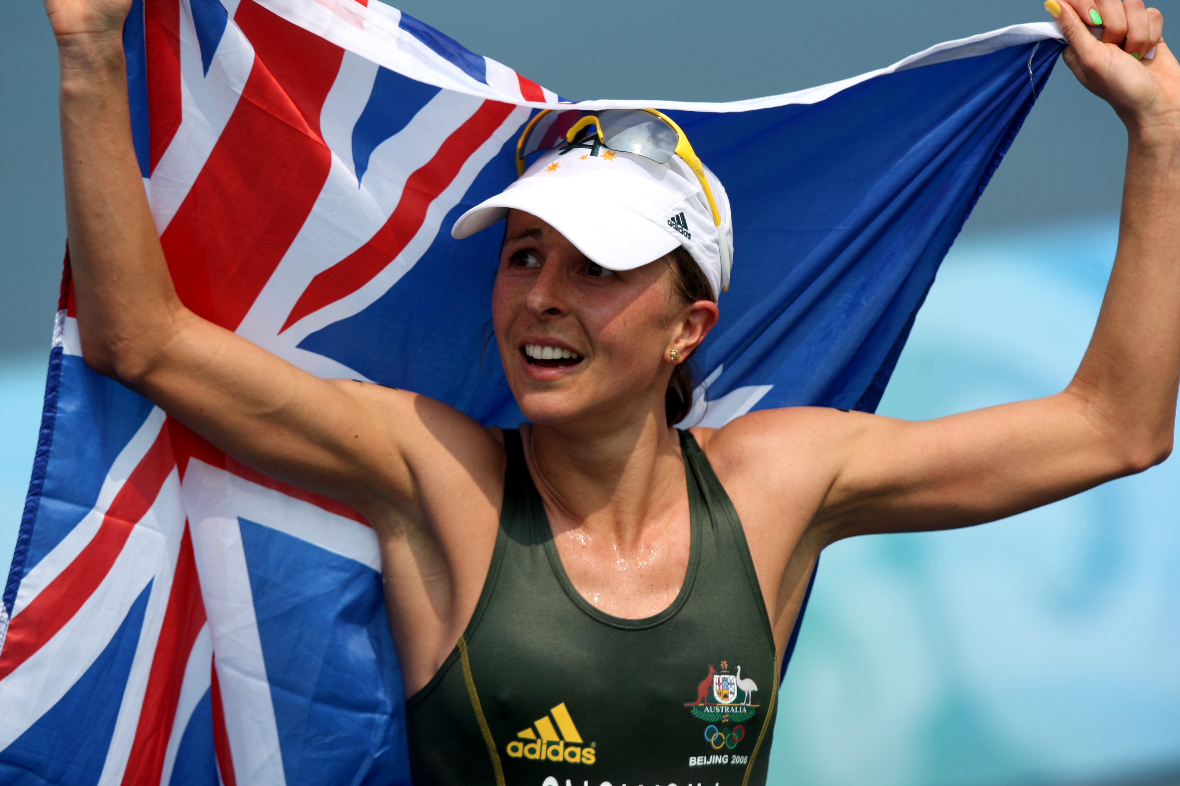 Emma Snowsill holds up the Australian flag