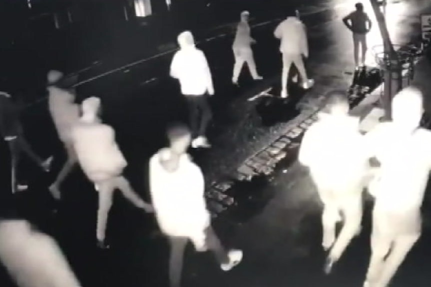 CCTV vision shows a group of people walking on the street.