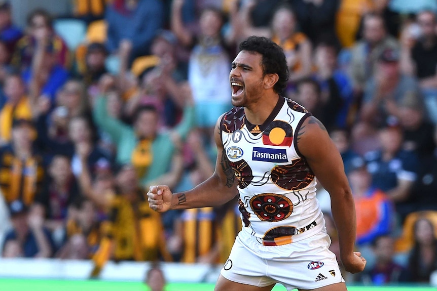 Cyril Rioli celebrates a goal against Brisbane