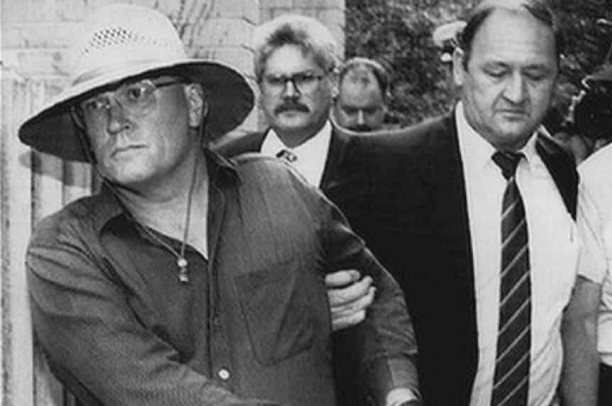 Video still: B&W photo of David Harold Eastman being arrested over the murder of AFP Assistant Police Commissioner Colin Winchester.