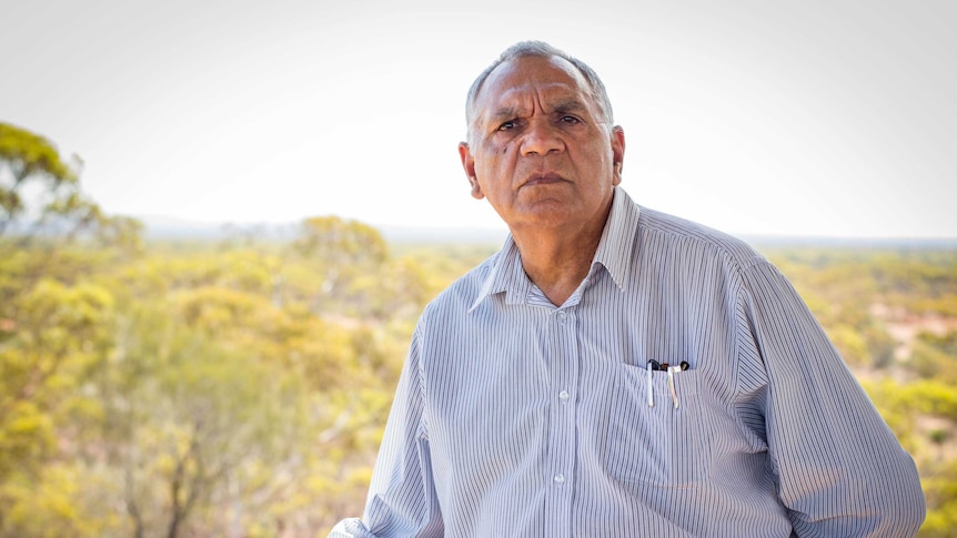 Goldfields elder Trevor Donaldson stands on a verandah.