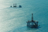 The semisubmersible offshore drilling rig in the foreground and a oil rig construction vessel on the North West Shelf.