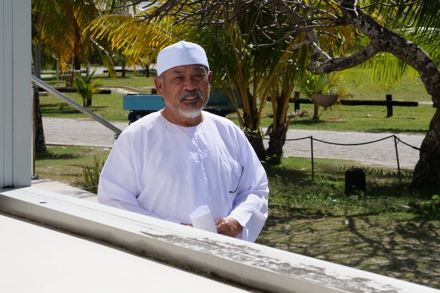 Cocos Island's Imam Haji Adam viewed through a window of the Home Island Mosque. 
