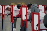 Voters fill out their ballots in the US election.