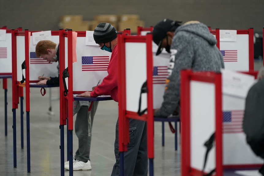 Voters fill out their ballots in the US election.