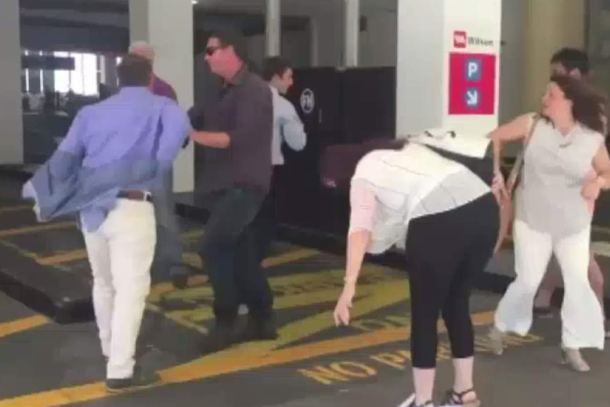 Rod Culleton removes his jacket during fracas