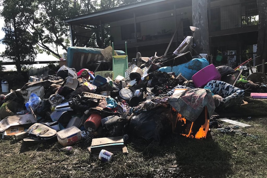 Mud covered belongings in Luscombe home