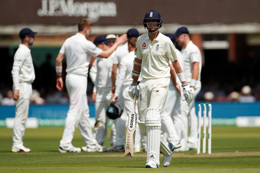 Stuart Broad trudges off as Ireland players celebrate his wicket behind him