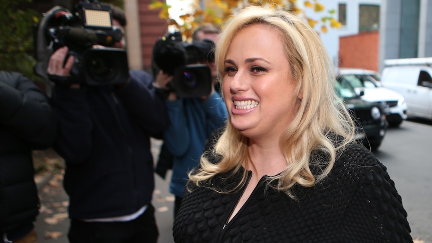 Actress Rebel Wilson smiles outside the Supreme Court in Melbourne