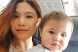 Selfie of Skye and Benny on a plane in story about how a working mum is coping without her village during coronavirus pandemic.