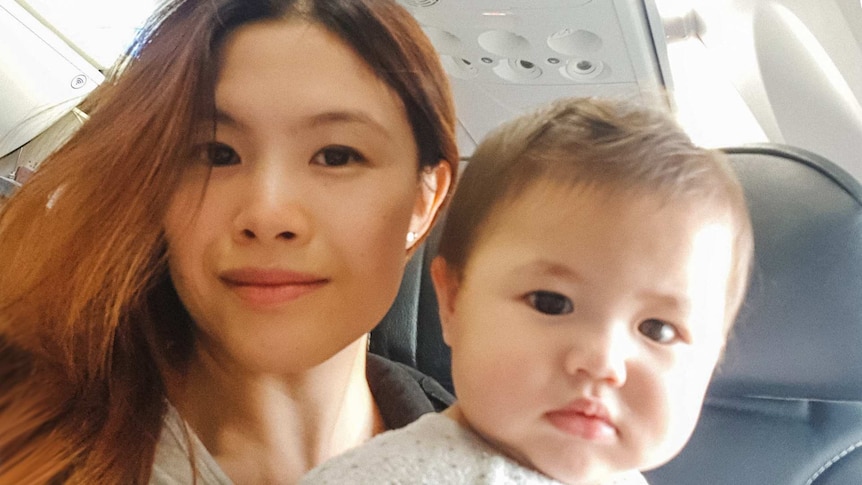 Selfie of Skye and Benny on a plane in story about how a working mum is coping without her village during coronavirus pandemic.