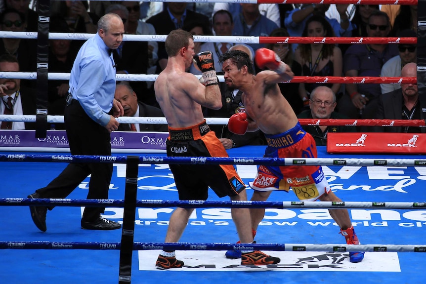 Manny Pacquiao aims a punch at Jeff Horn