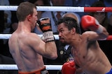 Manny Pacquiao aims a punch at Jeff Horn