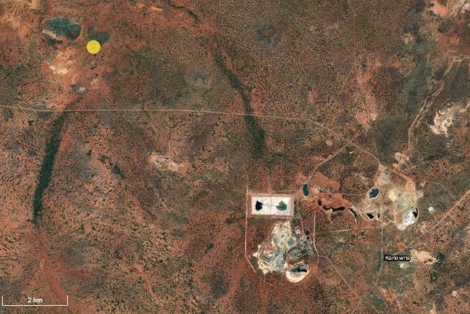 A map showing a gold mine and the location of an earthquake pin-pointed by a yellow mark.