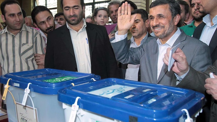 President Mahmoud Ahmadinejad casts his vote in Iran's election