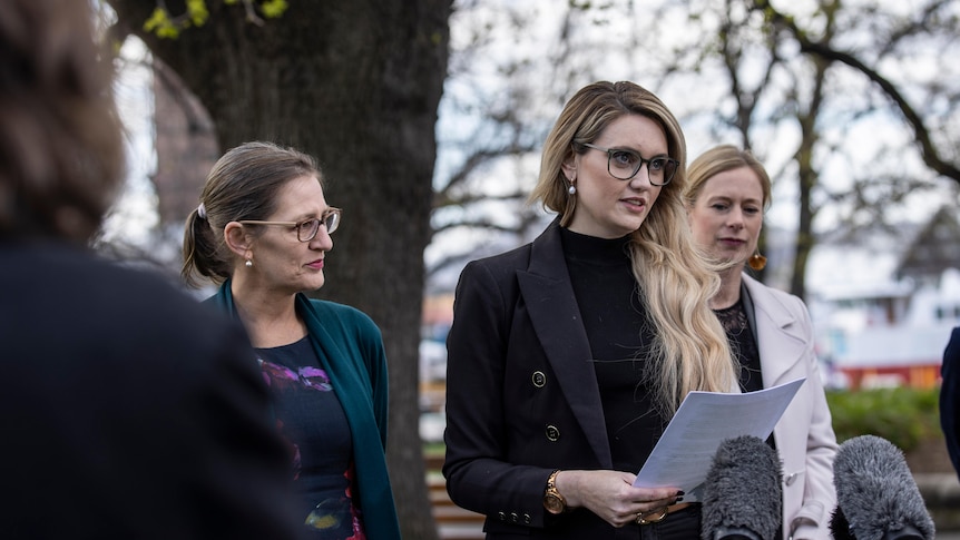 Alysha a sexual harassment complainant speaking on Parliament Lawns in Hobart.