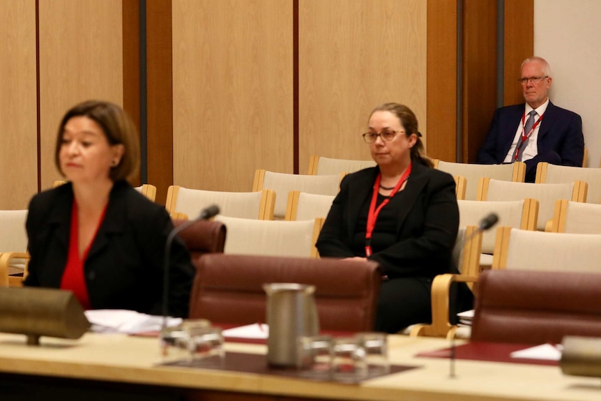 Former chairman Justin Milne watches managing director Michelle Guthrie giving evidence to a Senate inquiry into the ABC.