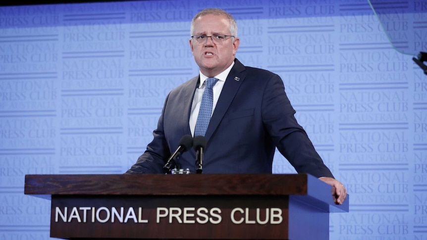 Scott Morrison reads from a teleprompter at the National Press Club.