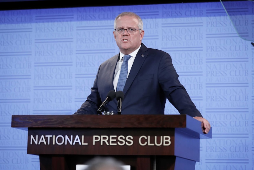 Scott Morrison reads from a teleprompter at the National Press Club.