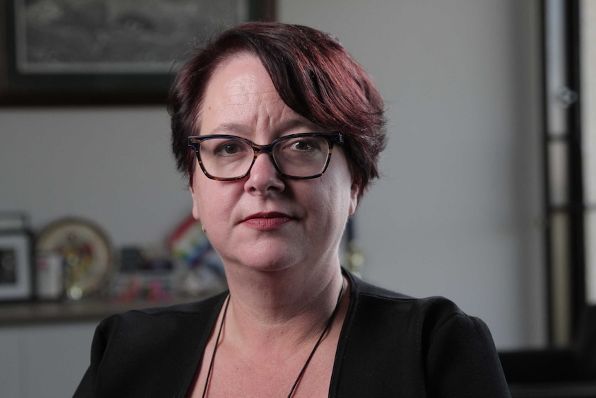 Head shot of Penny Sharpe, Labor NSW Upper House MP, in her office looking at the camera