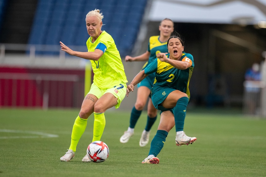Sam Kerr shouts in pain after kicking Caroline Seger instead of the football during the Australia-Sweden Tokyo Olympics match.