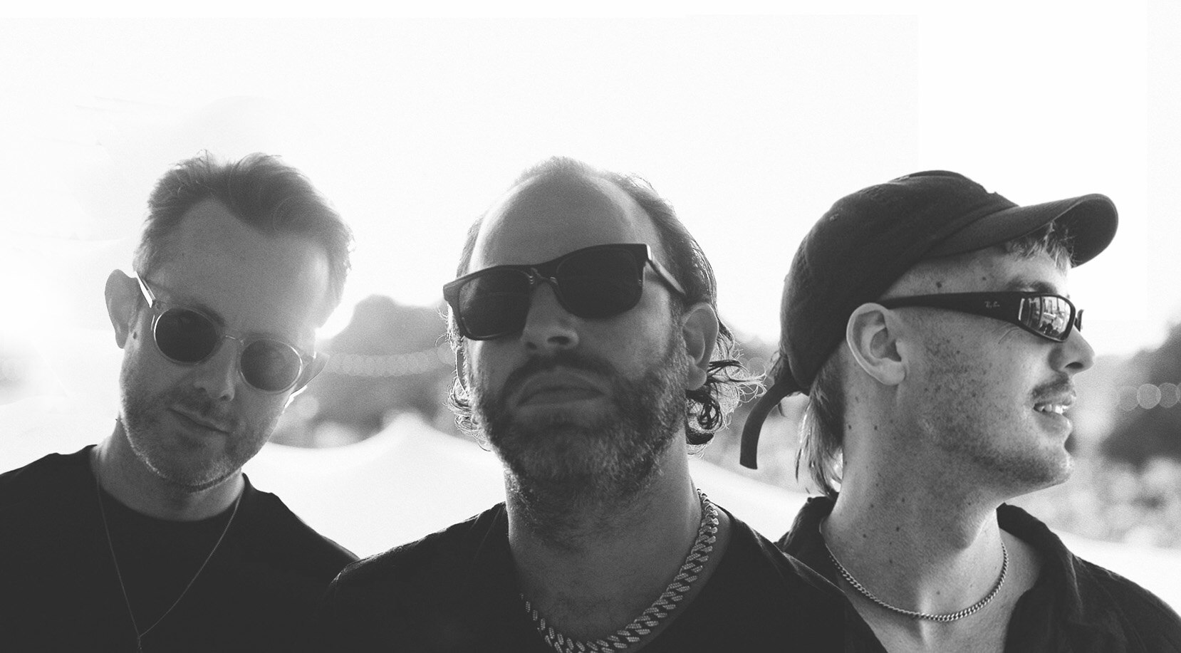 Black and white photo showing the heads and shoulders of Chase and Status and Luude.