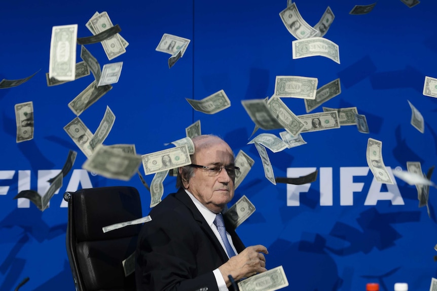 Fake money thrown at Sepp Blatter