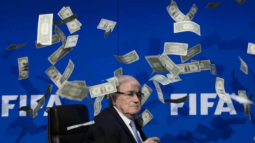 Fake money thrown at Sepp Blatter