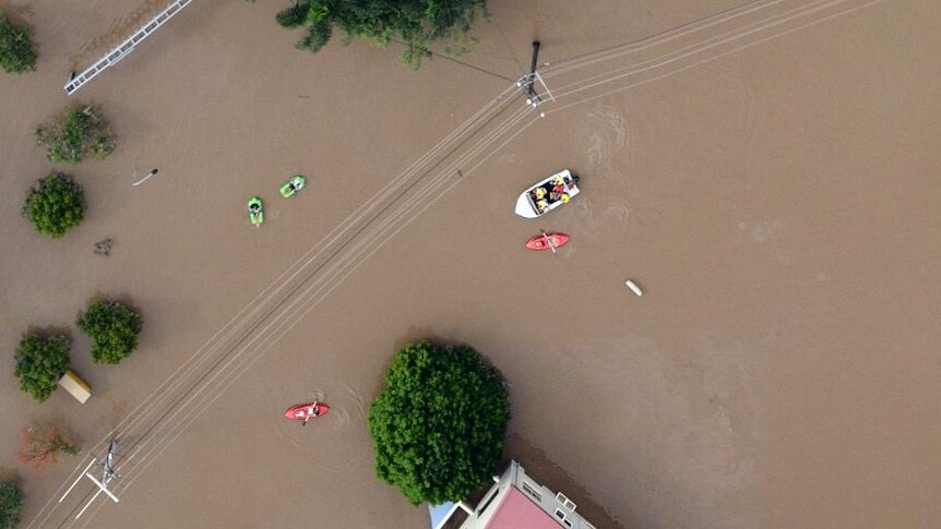 Milton flooded: kayaks and boats take to the floodwaters.