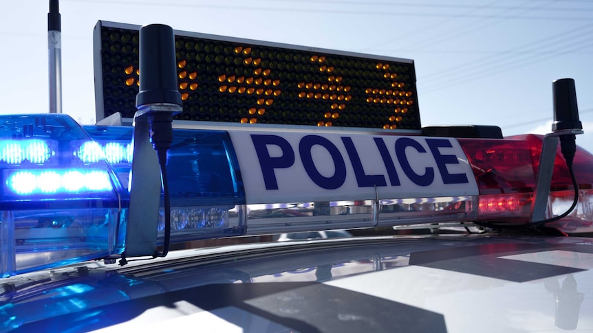 An SA Police vehicle with flashing lights.