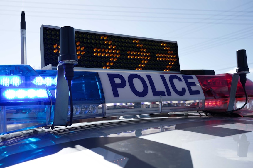 An SA Police vehicle with flashing lights.