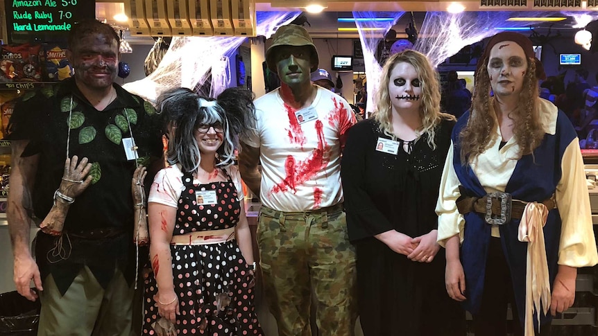 Bar staff at the Cobdogla Club in creepy Halloween costumes.