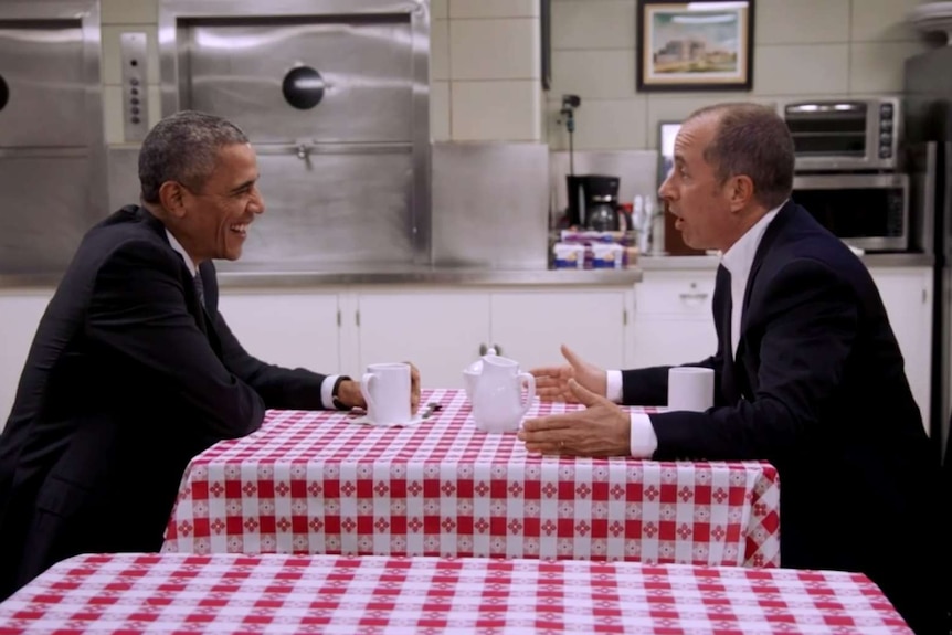 Barack Obama drinks coffee with Jerry Seinfeld in the White House staff dining room.
