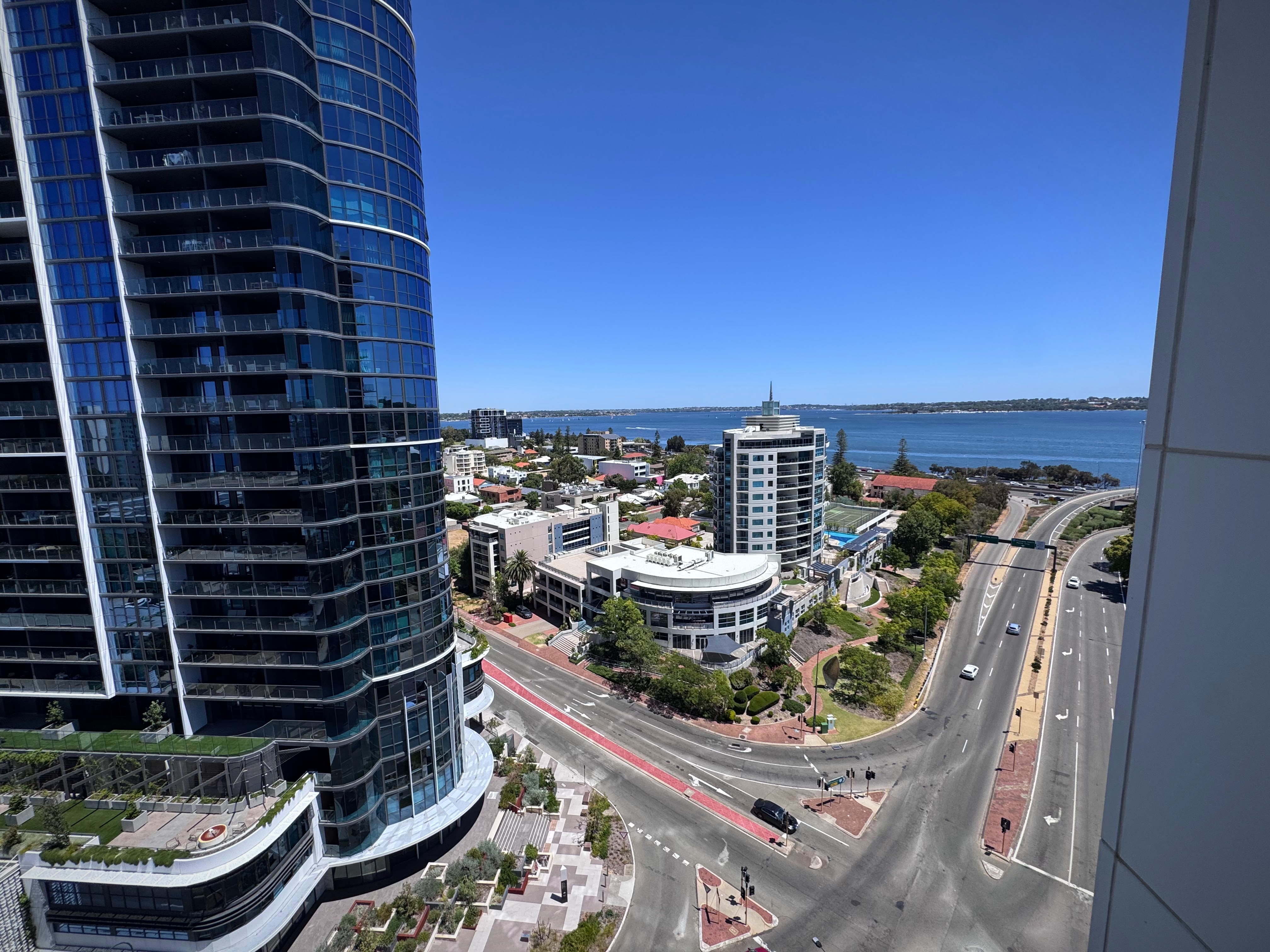 A photo taken of a streetscape from a high-rise