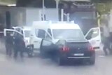 A screenshot of a video of the France prison van ambush.