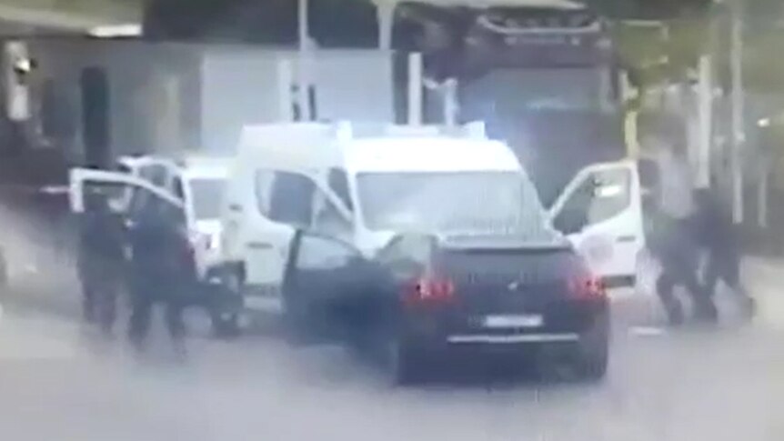 A screenshot of a video of the France prison van ambush.