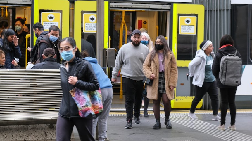 People disembarking a tram in Melbourne