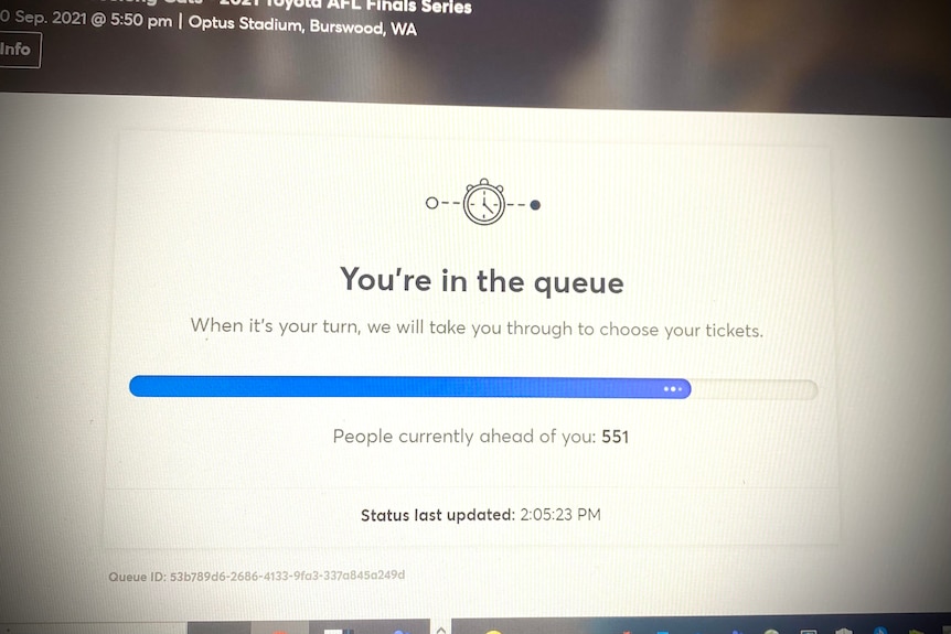 A website on a computer screen which reads "You're in the queue" and also says "There are 551 people ahead of you"
