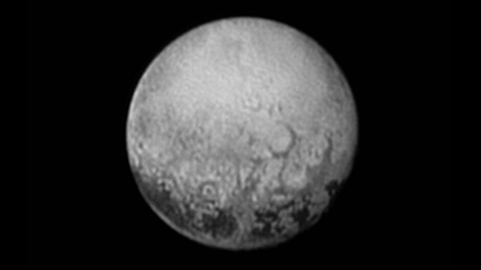 The New Horizons spacecraft captured this image of Pluto on July 11, showing four mysterious dark spots.