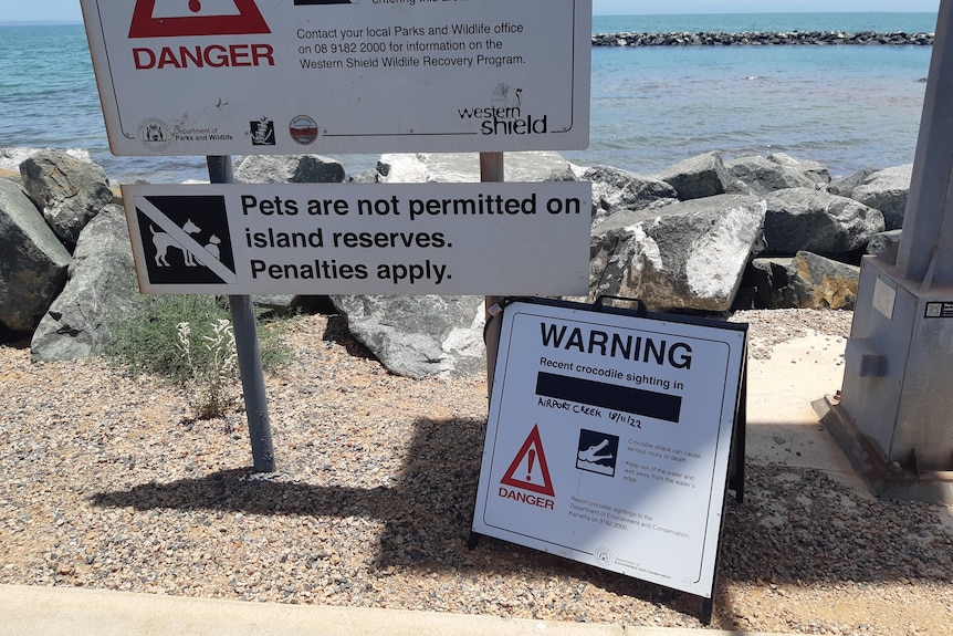 A crocodile warning sign.