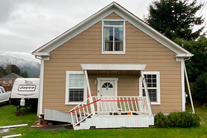 A house with a damaged front porch