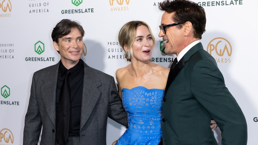 Cillian Murphy, Emily Blunt and Robert Downey Jnr laugh on the red carpet at the PGA awards