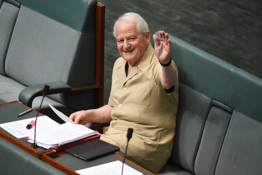 Philip Ruddock wears a safari suit for charity in the chamber at Parliament House in Canberra.
