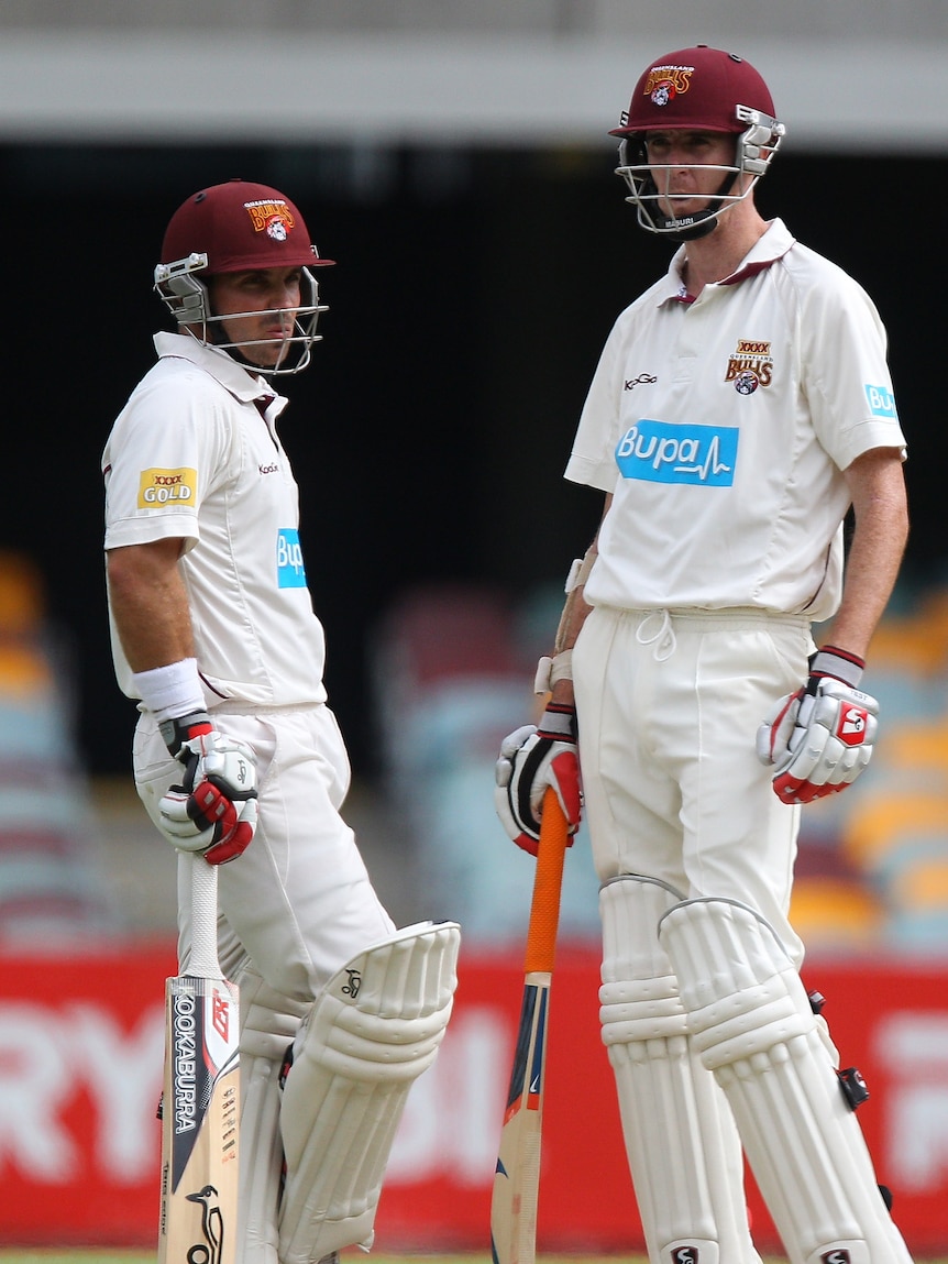 Unlikely hero ... bowler Steve Magoffin (r) proved just as handy with the bat in Queensland's dramatic Shield win