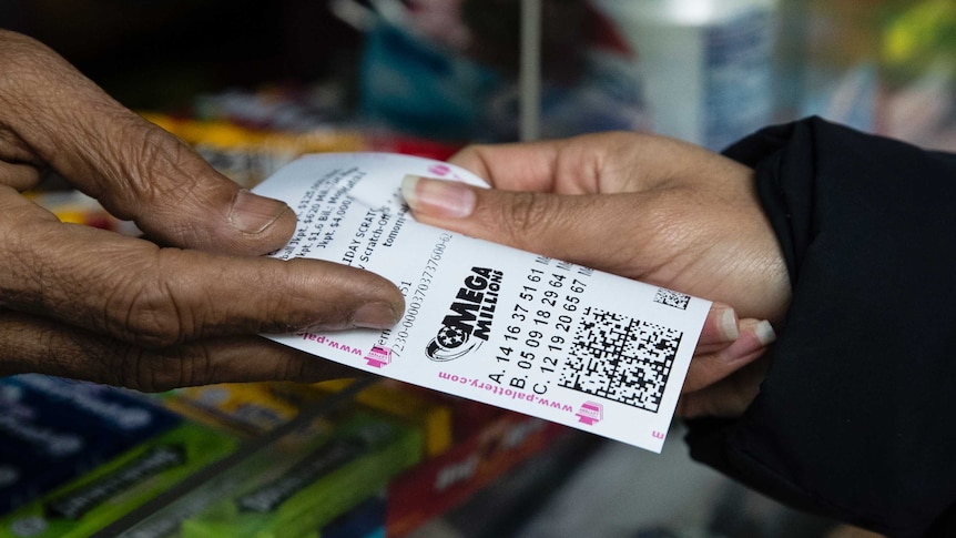 A close-up of a vendor selling a lottery ticket.