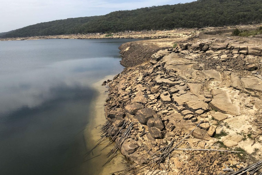 Parched, cracked land at the water's edge on Cataract Dam.