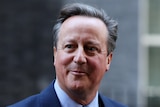 David Cameron walks outside 10 Downing Street in London.
