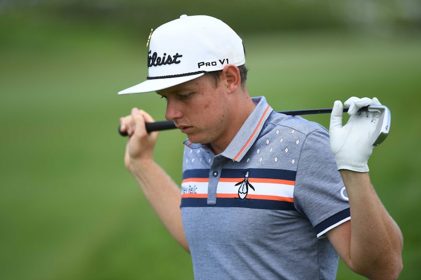 Cameron Smith holds a golf club behind his head at the Australian Open at The Lakes.